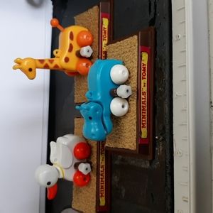 Set of three Minamals by Tomy white knob wind up toys..